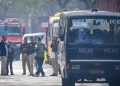 Police officials conducting security checks at a Delhi school after bomb threat email, students evacuated safely
