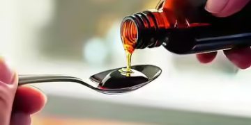 Cough syrup bottles displayed at a pharmacy as India introduces mandatory prescription requirements for syrup medicines.